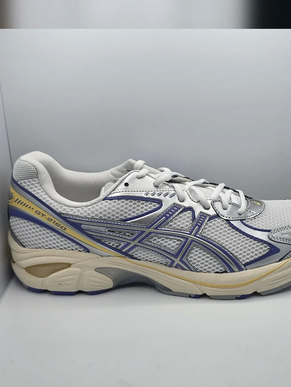 Asics Men's White Mesh Running Shoe with Blue and Cream Accents